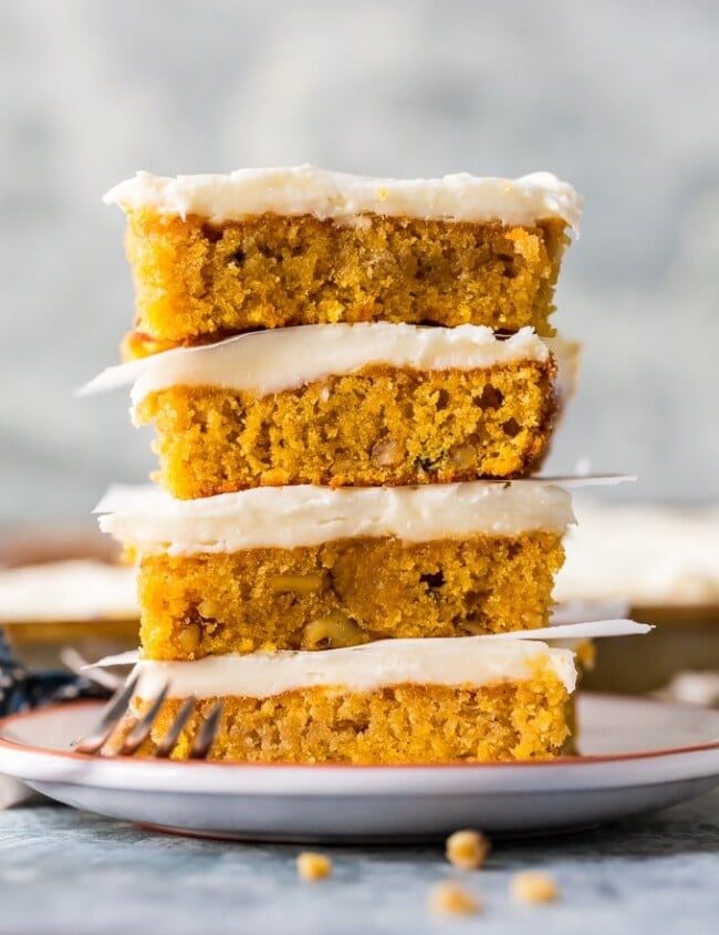 This CARROT CAKE BARS RECIPE has a secret ingredient, carrot baby food! You'll never believe how moist, simple, and delicious this EASY Carrot Cake can be. Try not to eat all the perfect cream cheese icing before piling it on and serving to your Easter guests. Best Carrot Cake Recipe ever!