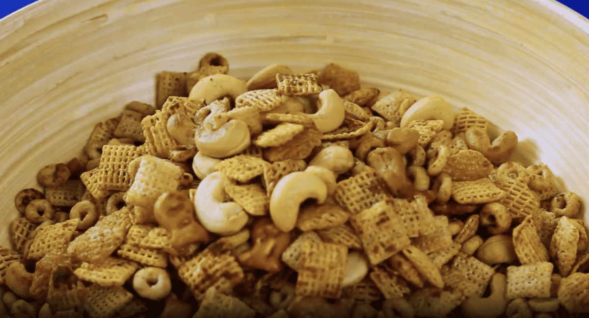 Cereal and nuts in a wooden bowl.