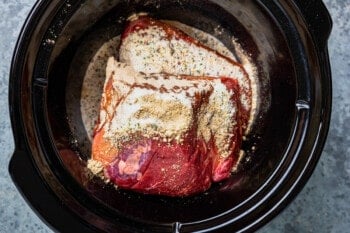 dressing mixes poured over beef in a crockpot.