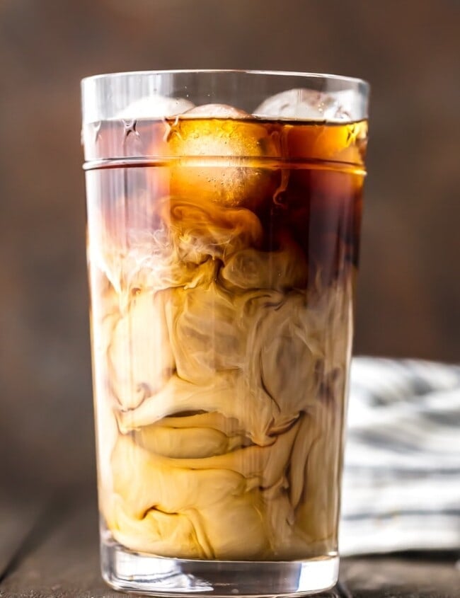 Iced Coffee is so easy to make at home, and even more delicious than you can buy at Starbucks or McDonalds! If you've ever wondered how to make Iced Coffee at home, you've come to the right place. This Iced Coffee is EASY, delicious, perfectly sweet, and so addicting. Having a glass of this Homemade Iced Coffee is the best way to start your day.