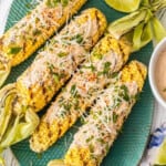 mexican grilled corn on a green platter
