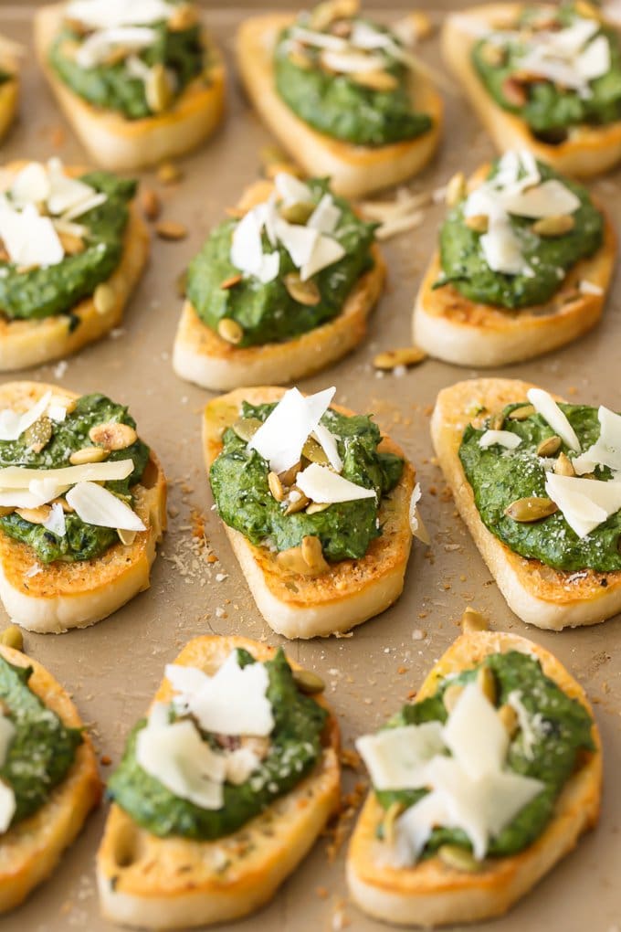 spinach dip crostinis arranged on a surface