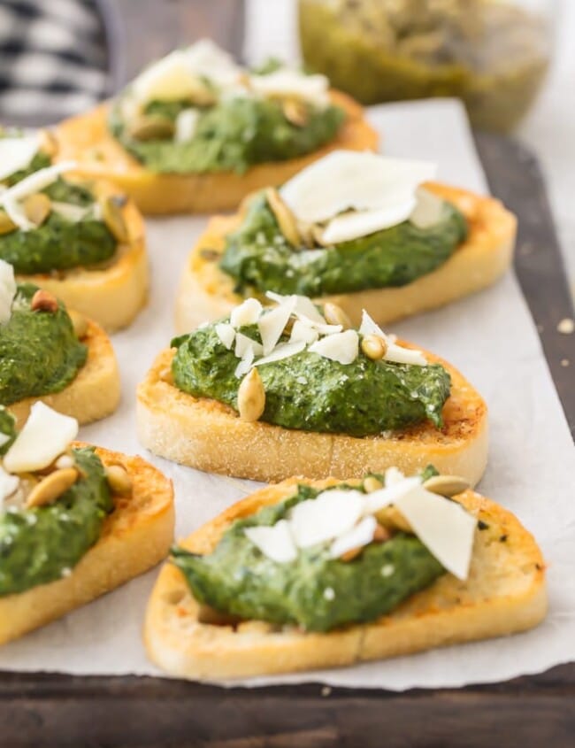 This Parmesan Spinach Dip Crostini is such a classy and unique appetizer to serve at your next party. Spinach Dip is loved by all, and now you don't need the chips to enjoy! Warm Parmesan Spinach Dip piled onto toasty French Bread is the ultimate in bruschetta recipes. This is one of our favorite game day or holiday recipes to make in a pinch.