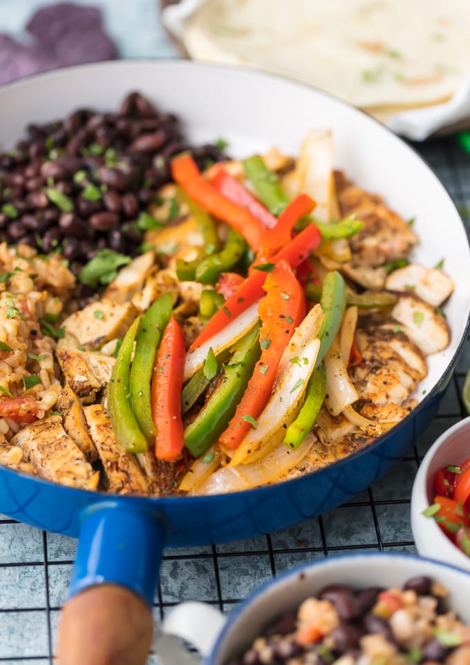 skillet filled with chicken, peppers, and black beans