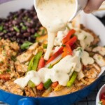 Chicken Fajitas have quickly become a favorite around here, especially this Queso Smothered Chicken Fajita Recipe! Traditional juicy Chicken Fajitas with all the veggies and spice, grilled to perfection, and smothered in cheese dip. This unique twist on a classic Mexican recipe is sure to please one and all and be requested again and again. Better than any Mexican Restaurant meal!