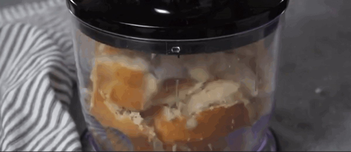 Processing bread to make breadcrumbs.