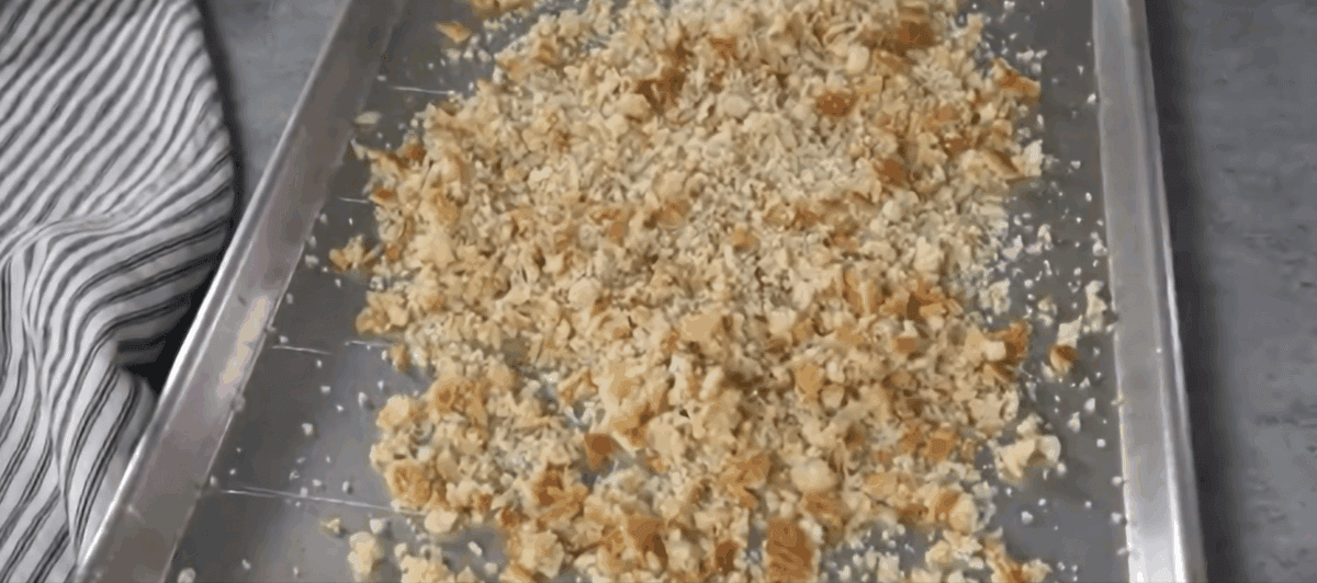 Breadcrumbs on a baking sheet.