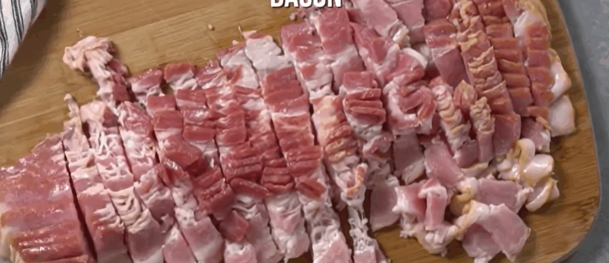 Chopped bacon on a cutting board.