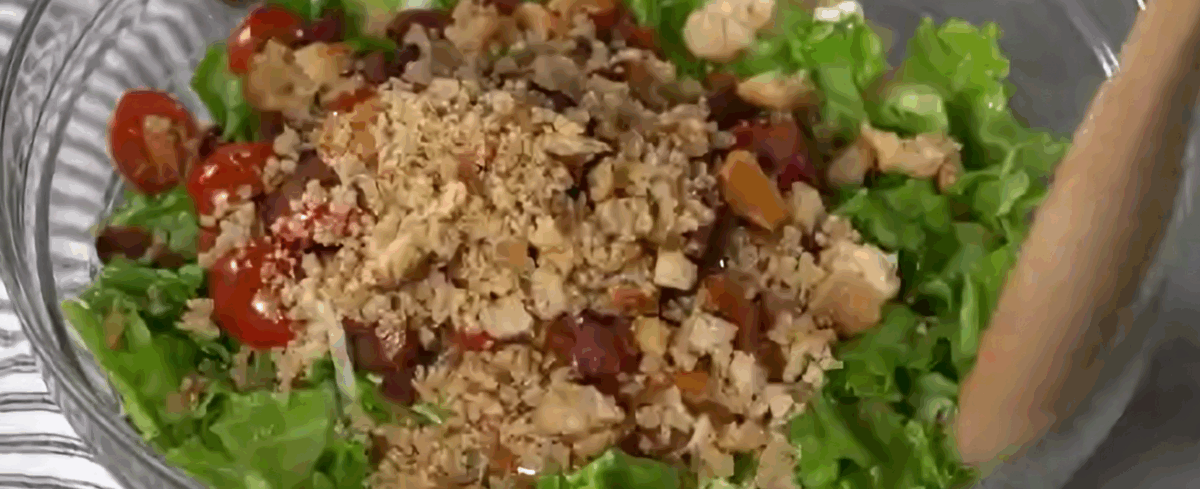 Assembling the BLT salad.