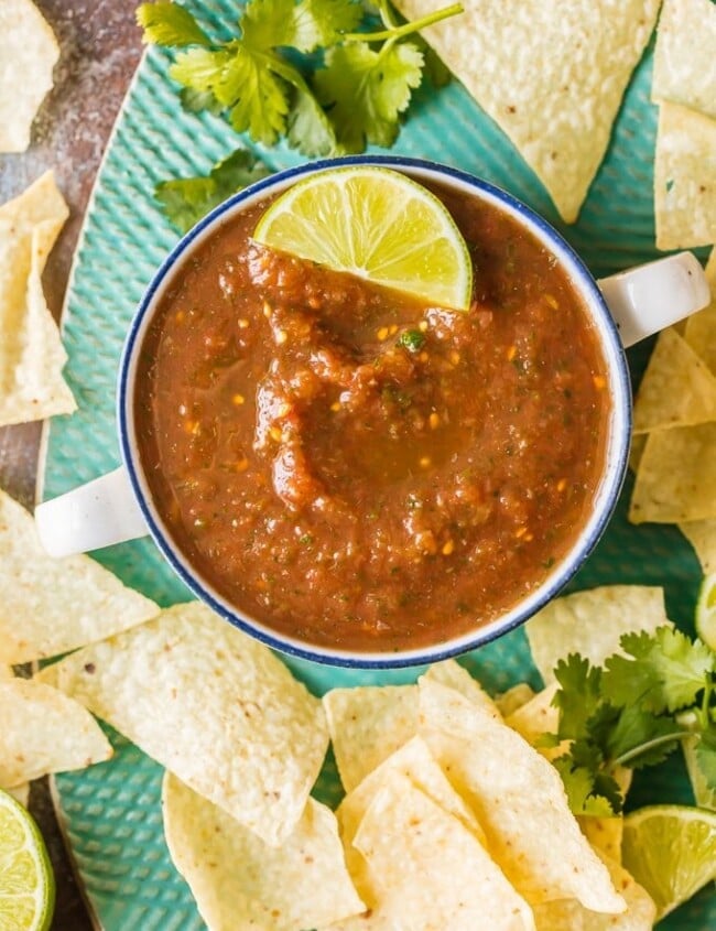 Homemade Salsa is a must for Cinco de Mayo! This easy homemade salsa recipe is the best salsa ever, just perfect for parties. So make this blender salsa, get out the chips, and serve it at every celebration you can think of. An easy salsa recipe for every occasion!