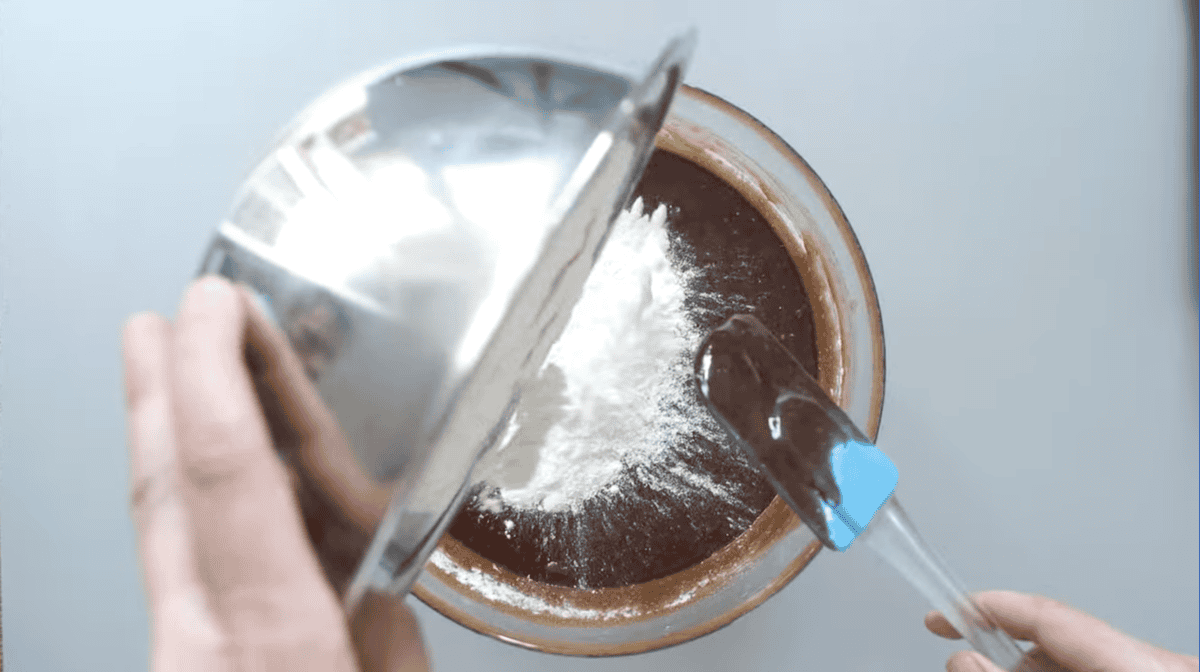 flour added to melted chocolate with a whisk.