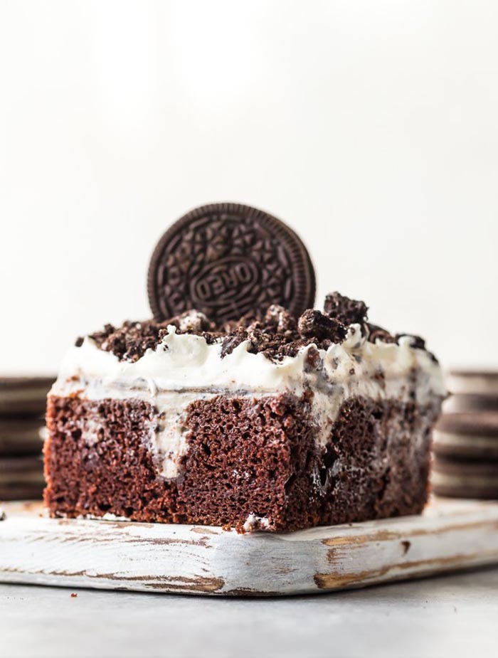 Creamy Oreo Poke Cake | The Cookie Rookie Poke Cake Recipes are a favorite at our house. There's nothing better than a Jello Poke Cake Recipe to make a celebration unique, tasty, and most importantly EASY! These 10 Pudding Poke Cake Recipes are simple. creamy, flavorful, and creative. Enjoy!