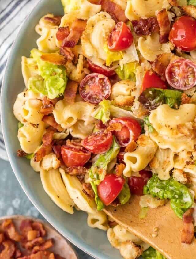 This BLT Pasta Salad Recipe is loaded with juicy tomatoes, crispy bacon, fresh lettuce, and tiny toasted croutons. BLT Pasta Salad is tossed in a flavored mayonnaise dressing and is the ultimate Summer Pasta Salad Recipe! BBQs, parties, and holiday celebrations like the 4th of July NEED this amazing side dish.
