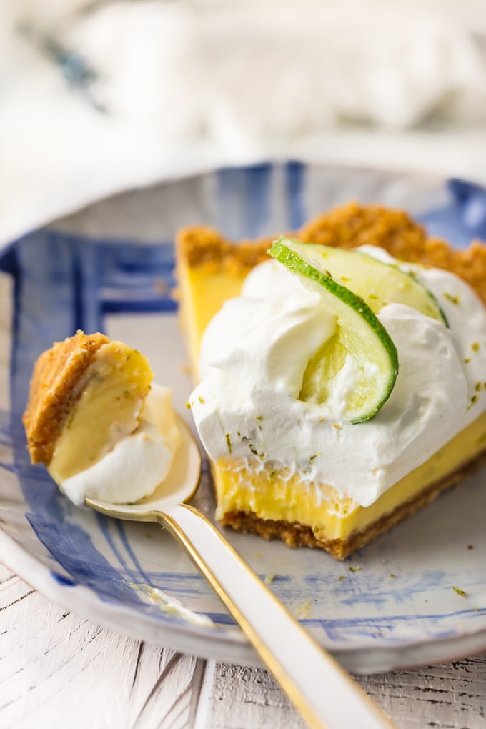 piece of key lime pie on plate with spoonful of pie