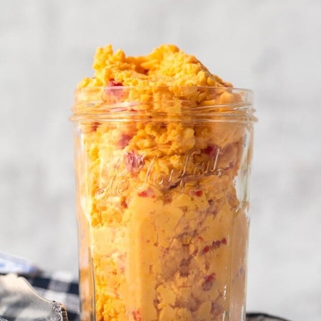 Want to learn How to Make Pimento Cheese? You've come to the right place! This Homemade Pimento Cheese recipe is bold and full of flavor. The classic Southern spread is perfect to serve at parties, and of course it makes an amazing Pimento Cheese Sandwich. With tasty Colby cheese and sweet Pimento peppers, this is the Best Pimento Cheese recipe out there!