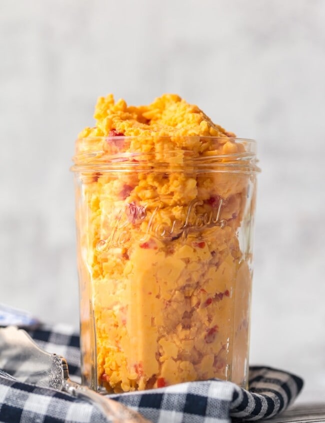 Want to learn How to Make Pimento Cheese? You've come to the right place! This Homemade Pimento Cheese recipe is bold and full of flavor. The classic Southern spread is perfect to serve at parties, and of course it makes an amazing Pimento Cheese Sandwich. With tasty Colby cheese and sweet Pimento peppers, this is the Best Pimento Cheese recipe out there!