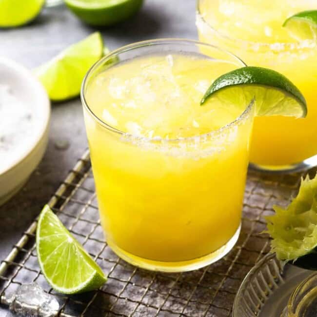 a skinny margarita in a rocks glass with a lime wedge.