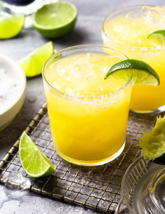 a skinny margarita in a rocks glass with a lime wedge.