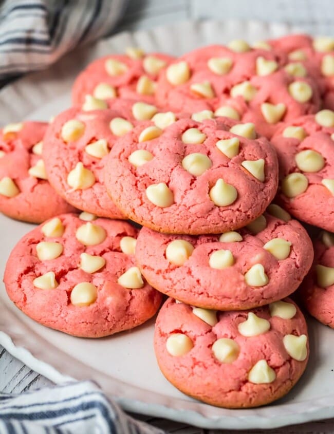 Strawberry Cookies are my favorite Strawberry Cake Mix Cookies! These White Chocolate Strawberry Cake Mix Cookies are so fun and delicious, and so super easy! Fun, festive, and SUPER SIMPLE! Strawberry Cookies with White Chocolate Chips are the perfect Pink Cookies for Valentine's Day, Easter, baby and wedding showers, and beyond! This Cake Mix Cookies Recipe will blow your mind.