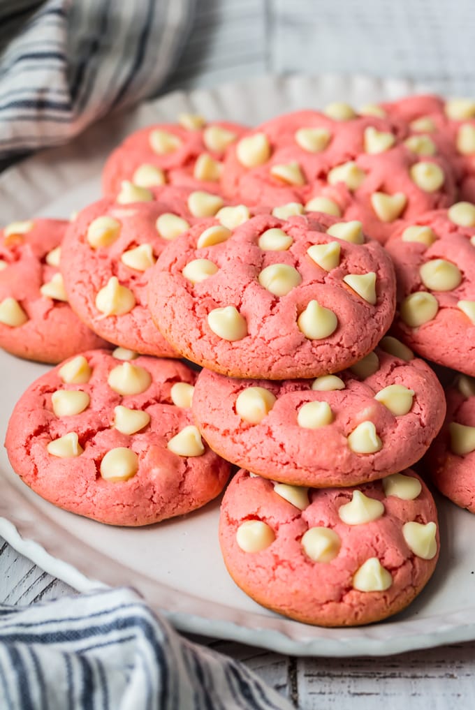 a plate of strawberry cookies made with cake mix and white chocolate chips.