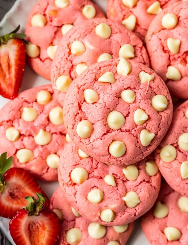 Strawberry Cookies are my favorite Strawberry Cake Mix Cookies! These White Chocolate Strawberry Cake Mix Cookies are so fun and delicious, and so super easy! Fun, festive, and SUPER SIMPLE! Strawberry Cookies with White Chocolate Chips are the perfect Pink Cookies for Valentine's Day, Easter, baby and wedding showers, and beyond! This Cake Mix Cookies Recipe will blow your mind.