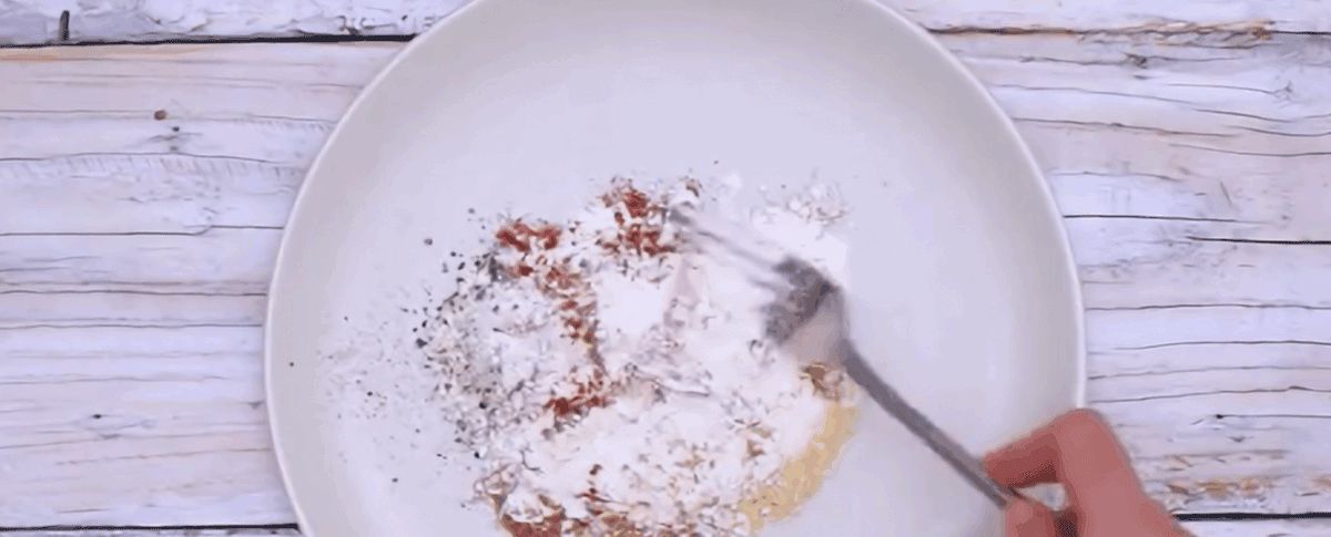 Preparing the flour seasoning mix. 