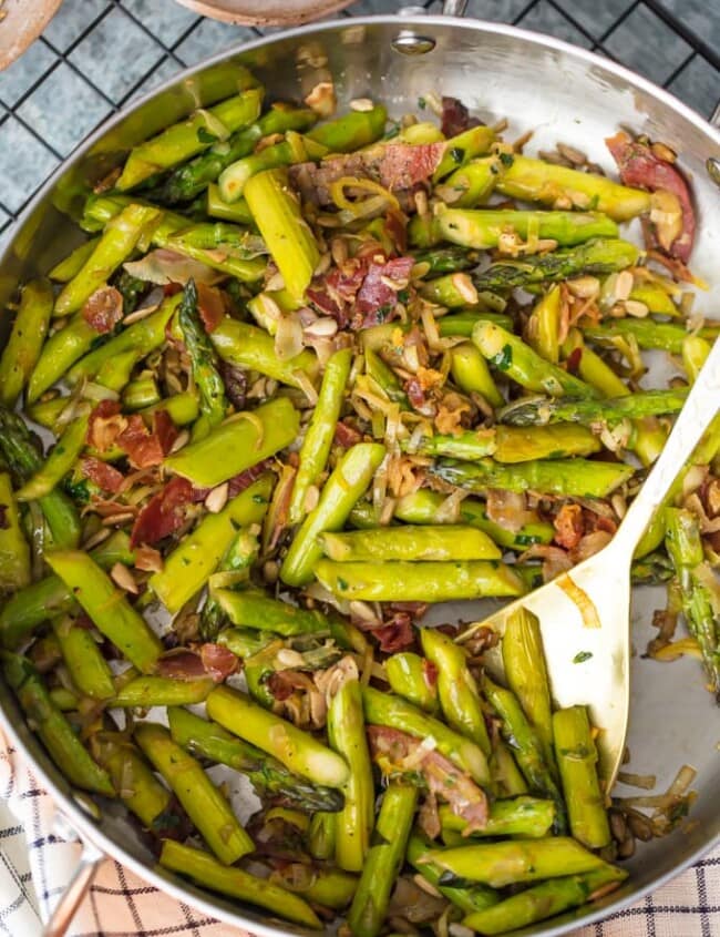 SAUTEED ASPARAGUS is the perfect side dish for any meal, and the Pancetta makes it even better! The leeks, garlic, and pine nuts add so much flavor to this dish...it just might be the Best Asparagus Recipe I've ever had. This Sauteed Asparagus Recipe with Pancetta is good enough to eat on its own, but it pairs well with other pork recipes.