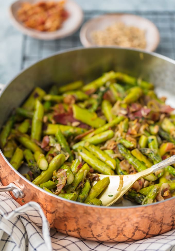 Bright green asparagus cooking in a skillet
