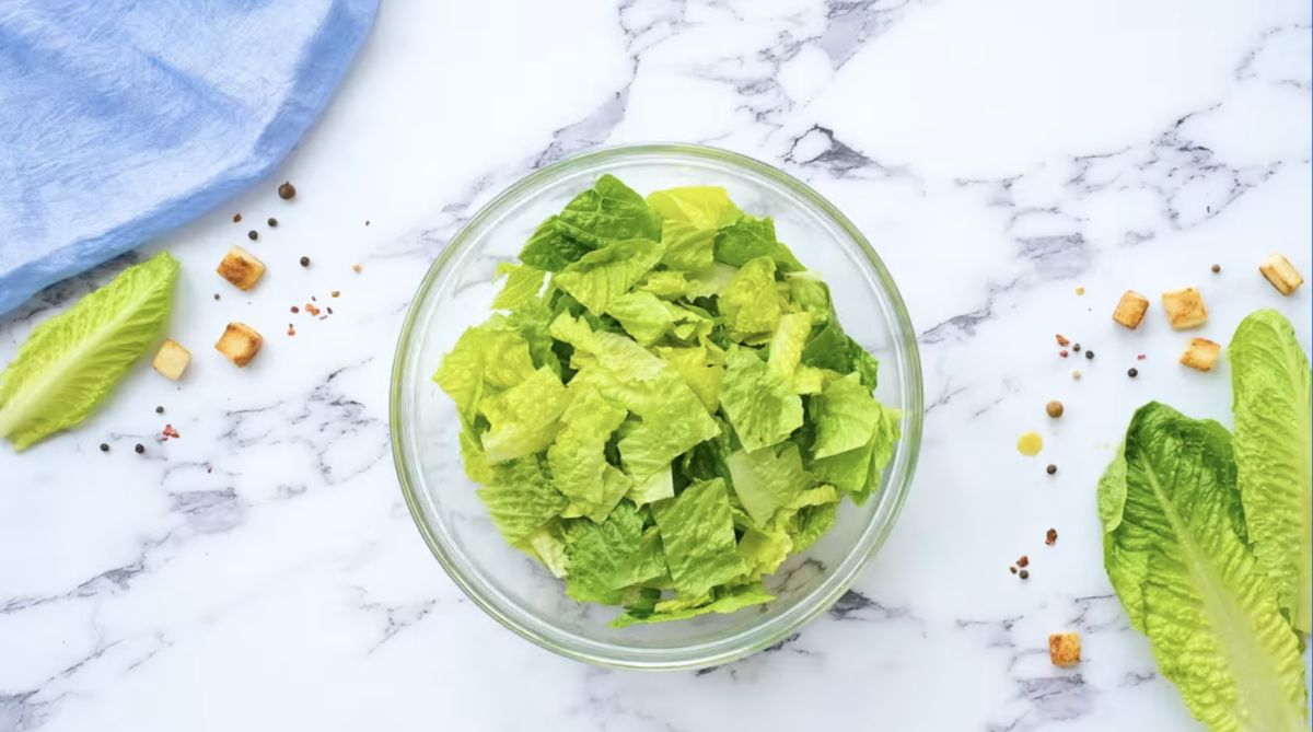 chopped romaine lettuce in a glass bowl.