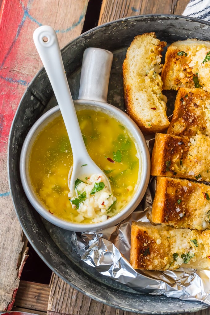Homemade Garlic Bread is the absolute BEST Garlic Bread Recipe we have ever tried! If you want to learn How to Make Garlic Bread where the butter melts deep into the bread, creating the ultimate garlicky, carb filled side dish, you've come to the right place. We bake it, then broil it, to make it crispy on the outside while staying soft and buttery on the inside.