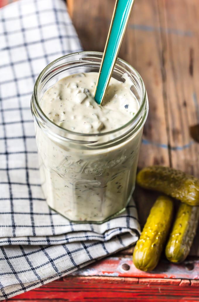 Homemade tartar sauce in a jar, sitting on a dish towel