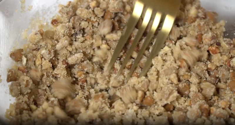 crumble topping in a bowl with a fork.