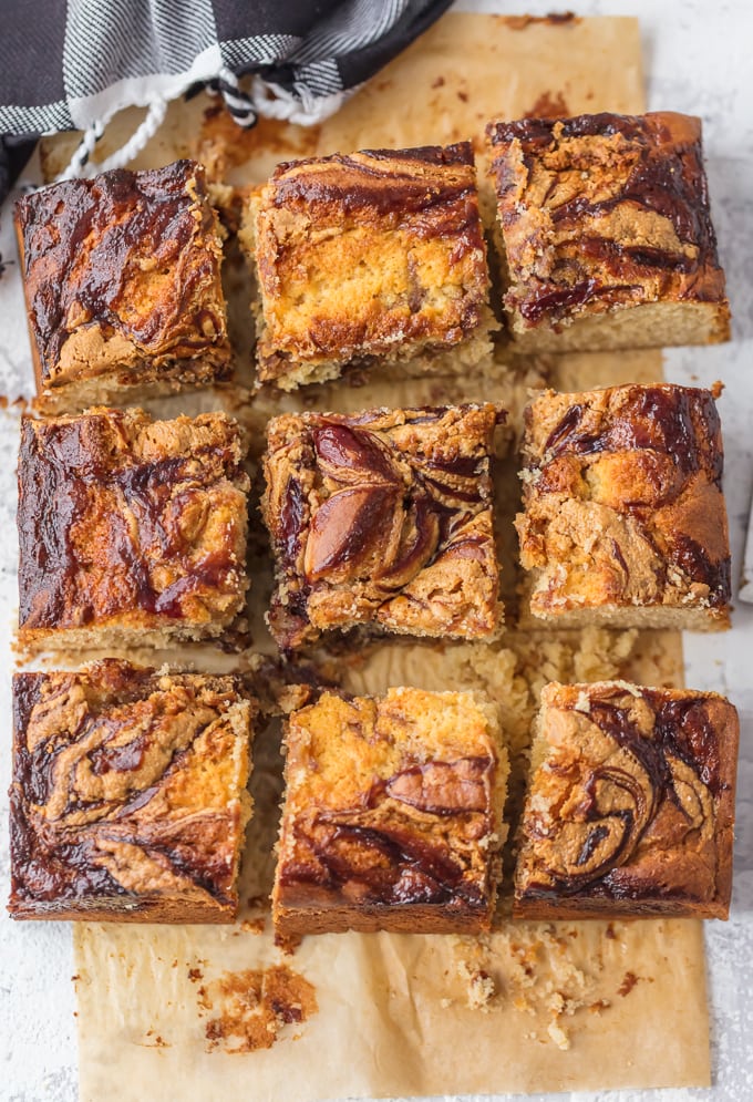 Peanut Butter and Jelly Bars arranged on a wood board