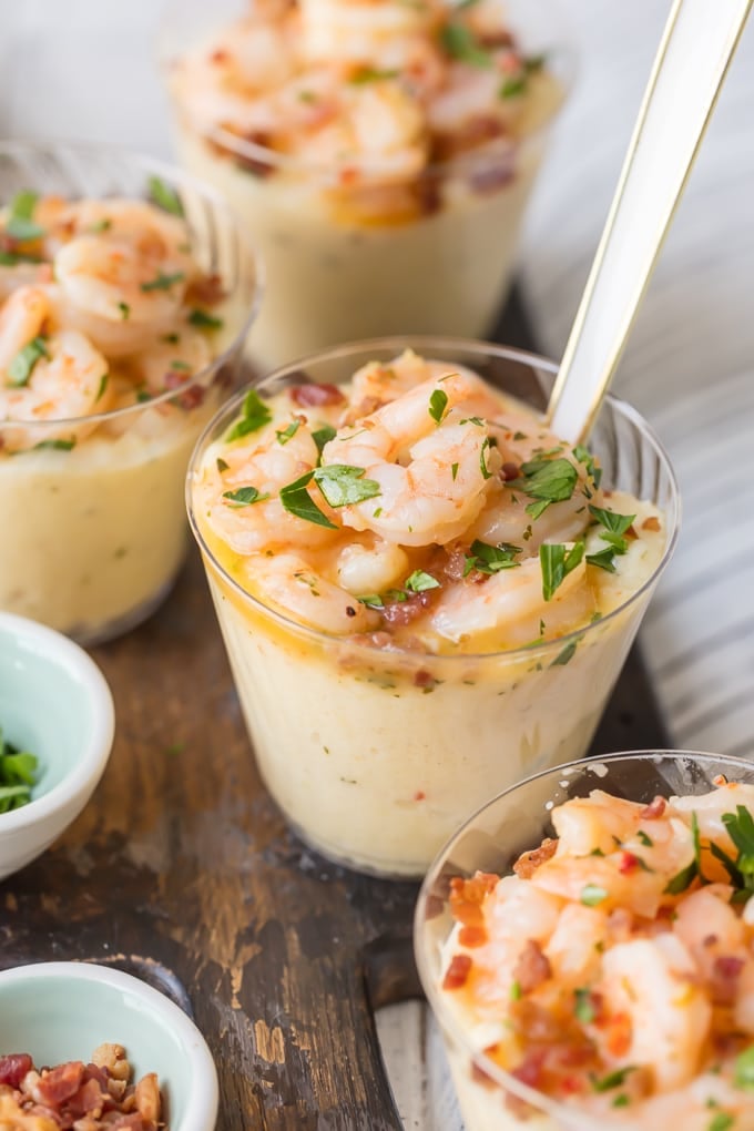 shrimp and grit cups with a fork