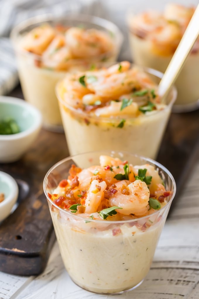 several cups of shrimp and grits