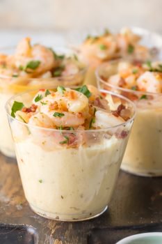 These Shrimp and Grits Appetizer Cups are so cute, delicious, EASY, and fun. I love the creamy cheese grits topped with the most flavorful Garlic Butter Shrimp. This is the best EASY Shrimp and Grits Recipe that you can make for a main course, or split into individual small cups for deceptively simple yet elevated appetizer.