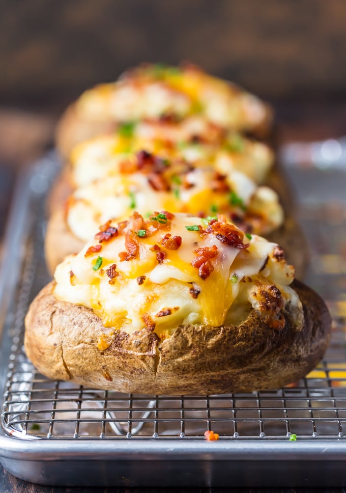 Twice baked potatoes filled with cheese, sour cream, and bacon