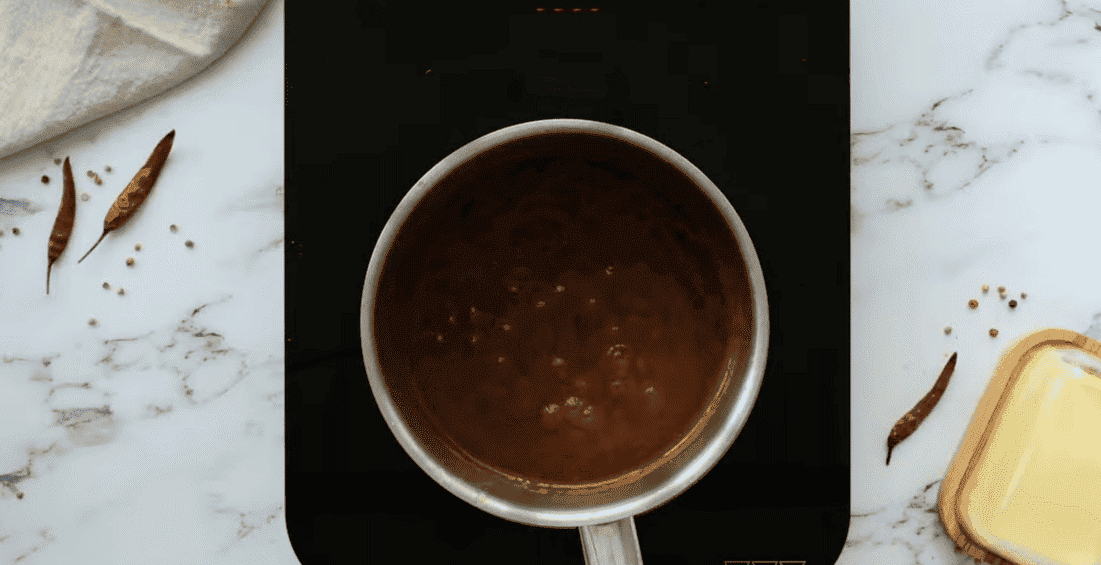 Ingredients to make Buffalo sauce in a pot.