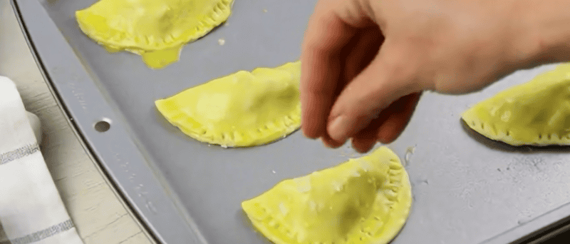 Sealed hand pies with egg wash and flaky sea salt.