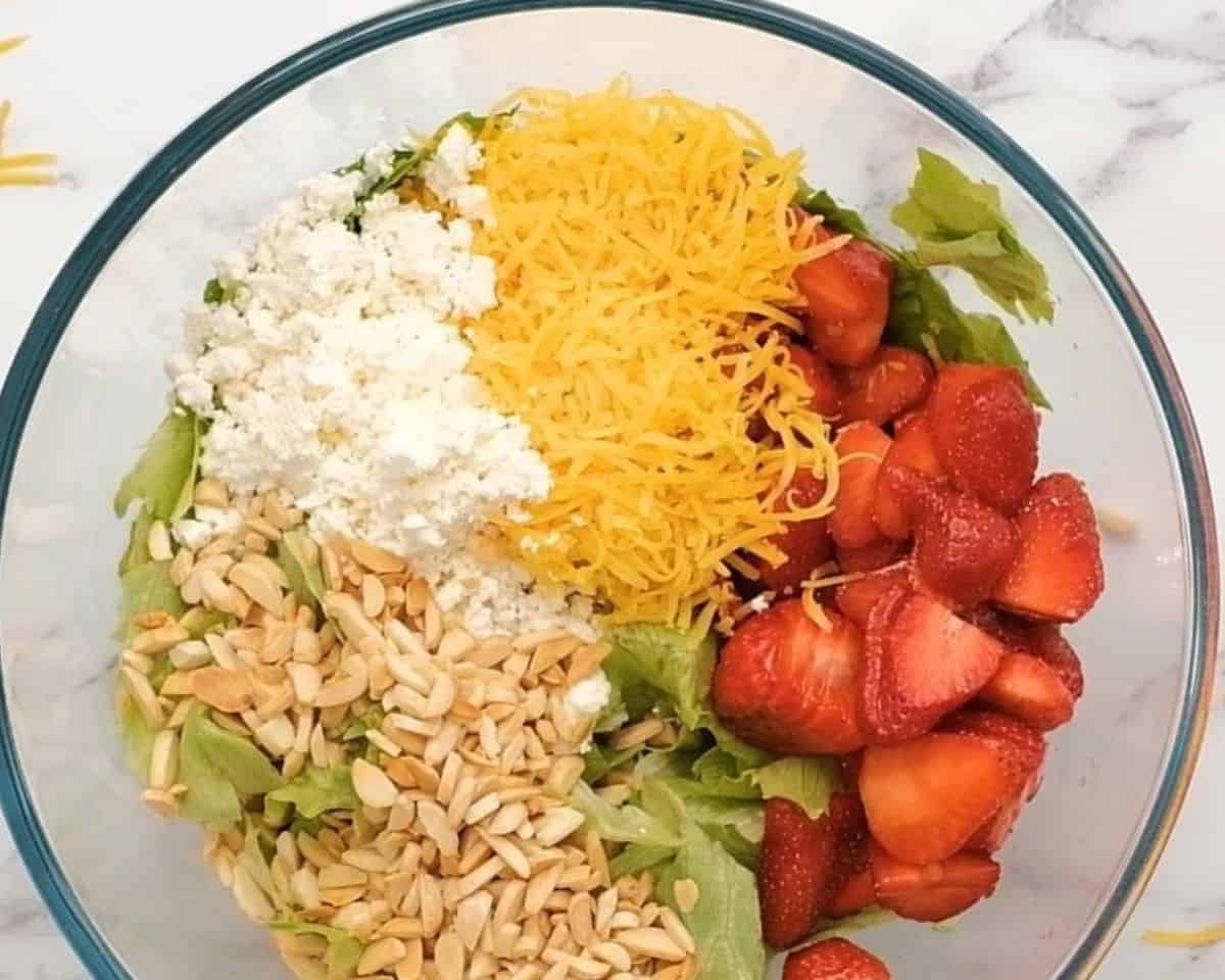 Combining the ingredients in a glass bowl.