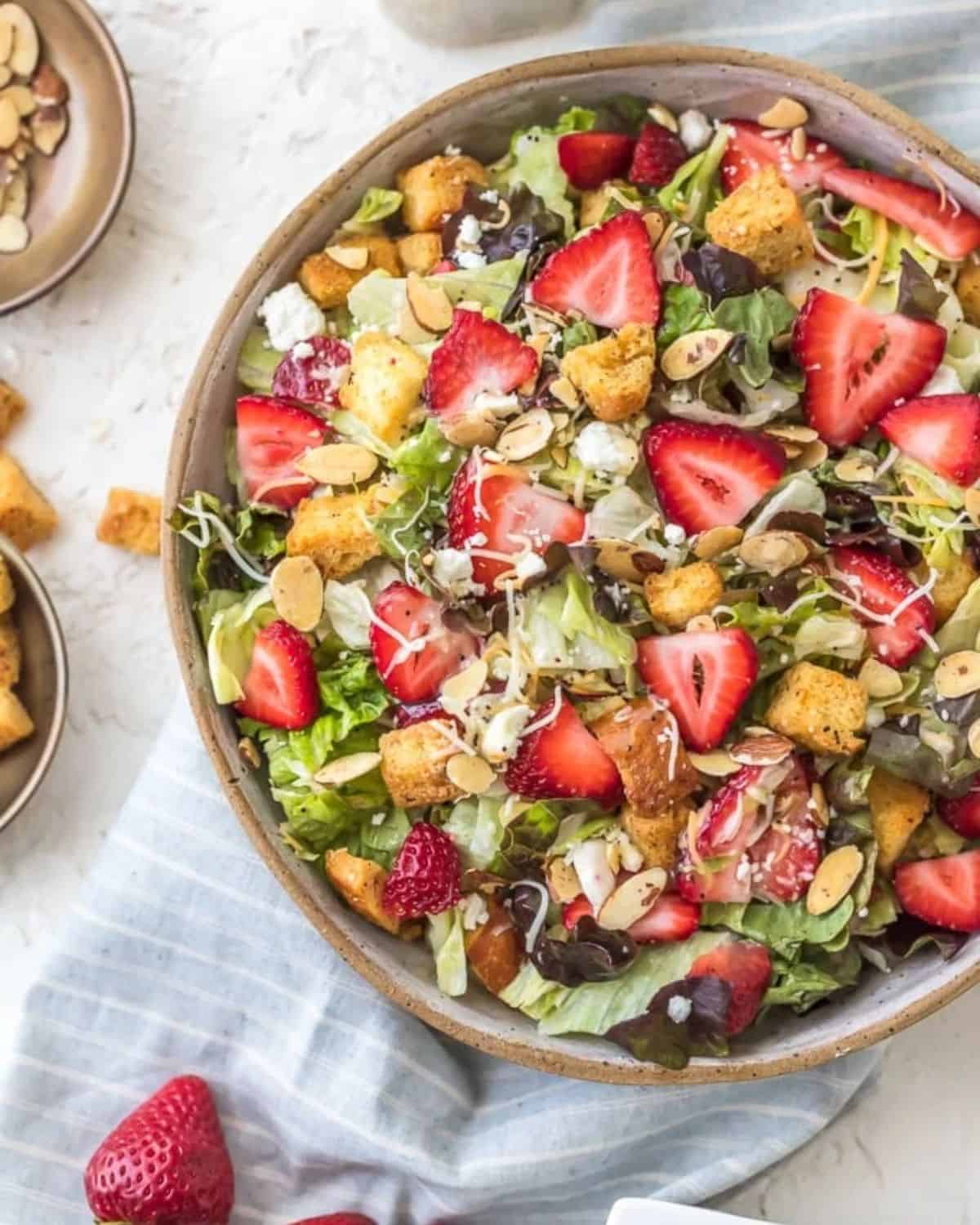 Bowl of strawberry salad with poppy seed dressing. 