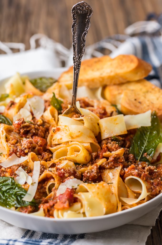 Beef Bolognese is a delicious meat-based sauce served with pasta, and topped with basil and freshly grated cheese. This is the best bolognese sauce recipe outside of Italy! Fork stuck into a bowl of beef bolognese