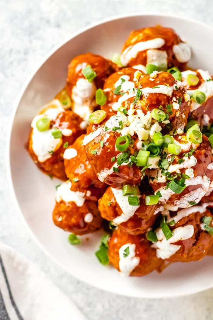 buffalo chicken meatballs garnished with ranch and green onion