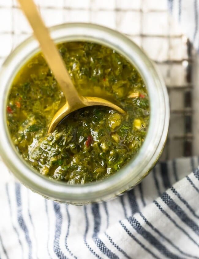 Chimichurri Sauce is a simple yet delicious sauce that is mostly used on grilled meats (Chimichurri Steak Sauce). This green Chimichurri Sauce recipe is filled with herbs and spices, with an olive oil base. It's the perfect marinade for meats, a great sauce for roasted cauliflower, or an interesting dip for all kinds of foods. Find out how to make Chimichurri Sauce for your next grilled dish!