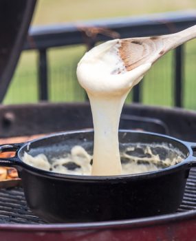 Easy Cheese Fondue with Grilled Bread is such a fun, quick, and EASY appetizer to make on the grill this Summer! There's nothing more satisfying that toasted bread dipped in cheese dip...especially if the cheese dip only have THREE INGREDIENTS! This easy fondue recipe with grilled bread is my idea of the ultimate and perfect appetizer!
