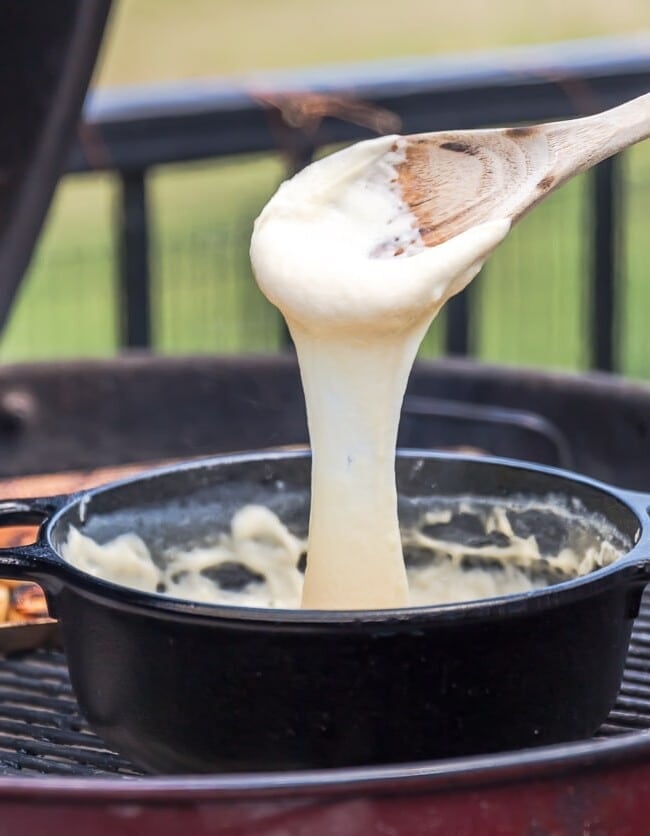 Easy Cheese Fondue with Grilled Bread is such a fun, quick, and EASY appetizer to make on the grill this Summer! There's nothing more satisfying that toasted bread dipped in cheese dip...especially if the cheese dip only have THREE INGREDIENTS! This easy fondue recipe with grilled bread is my idea of the ultimate and perfect appetizer!
