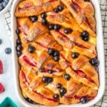 croissant french toast casserole in a white dish