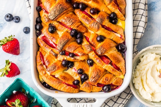 Croissant French Toast Casserole with Berries and Cream is our favorite easy brunch recipe fit for your closest friends and family. This indulgent breakfast French Toast Bake is made with layers of buttery croissants, sugary cream cheese, and fresh berries. You can make it ahead or right before you're ready to eat. Baked French Toast Casserole with Strawberries and Blueberries is the ultimate way to wake up!