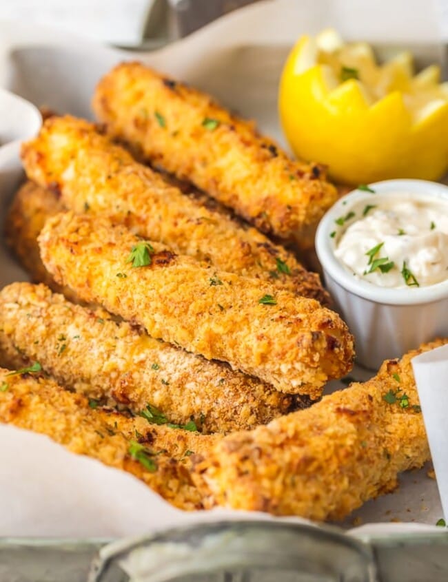 This homemade FISH STICKS recipe is baked instead of fried, making them crispy, tender, & flaky. These baked fish sticks aren't complete without homemade tartar sauce!