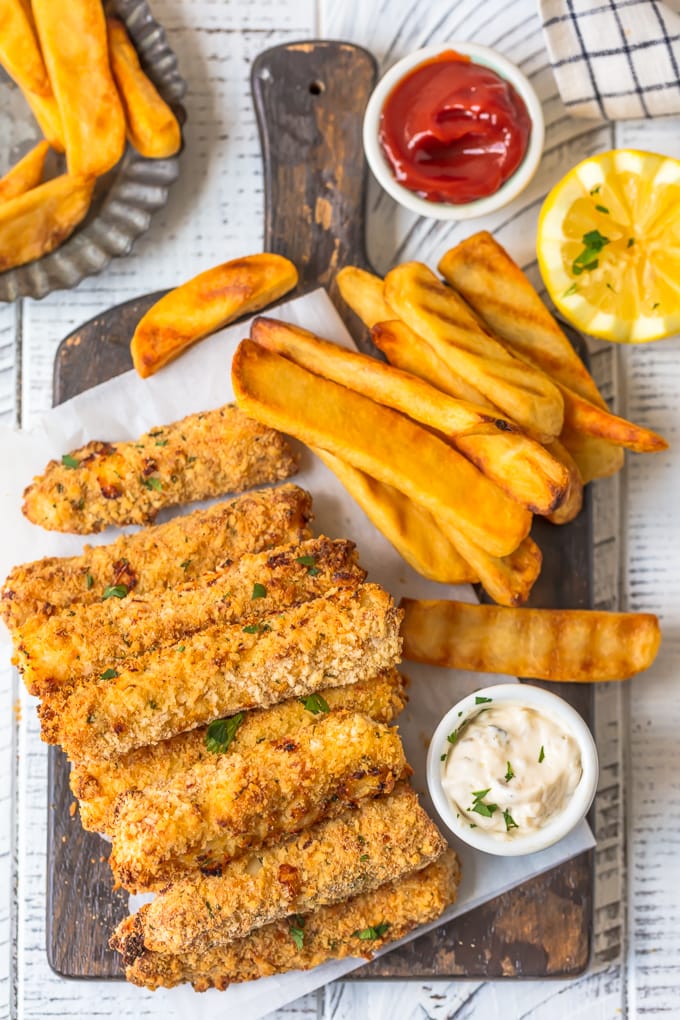 Fish sticks, french fries, tartar sauce, ketchup